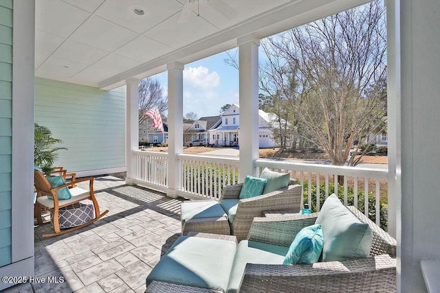 sunroom / solarium featuring a residential view