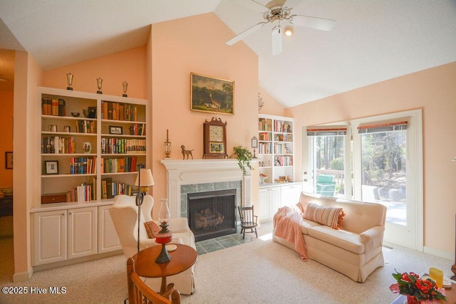 living area with high vaulted ceiling, a ceiling fan, carpet, and a fireplace