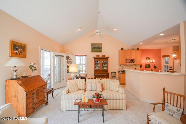 living area featuring recessed lighting, light carpet, high vaulted ceiling, and ceiling fan