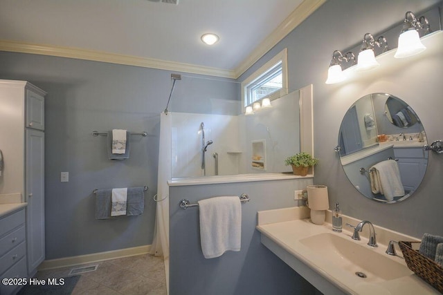 bathroom featuring visible vents, crown molding, tile patterned flooring, a shower, and baseboards