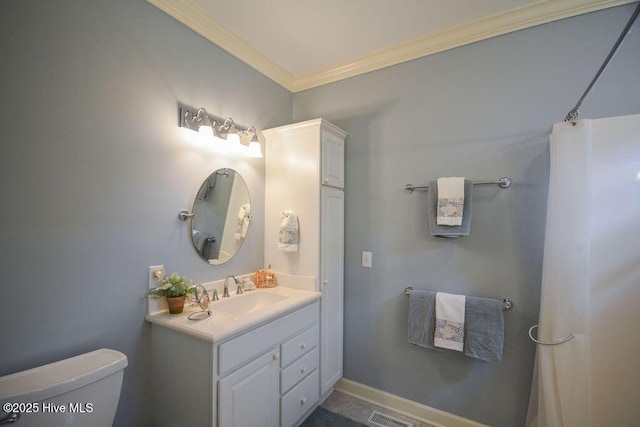 bathroom featuring visible vents, crown molding, baseboards, toilet, and vanity