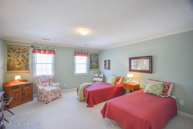 bedroom featuring baseboards, a textured ceiling, carpet floors, and ornamental molding