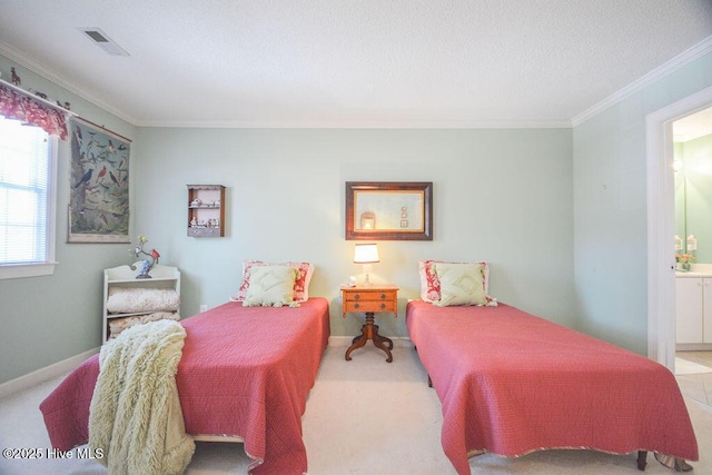 bedroom with visible vents, connected bathroom, crown molding, baseboards, and a textured ceiling