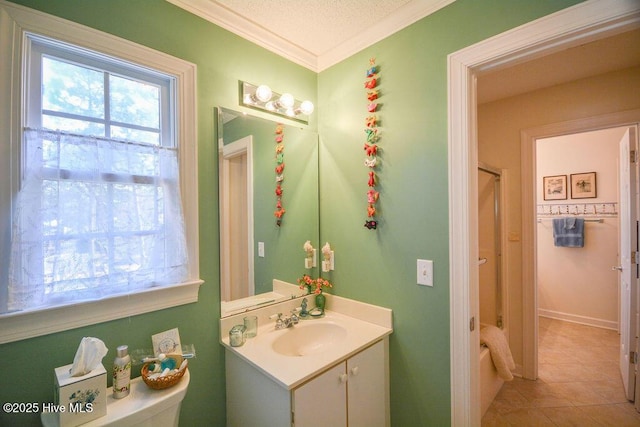 full bathroom featuring vanity, tub / shower combination, ornamental molding, tile patterned flooring, and a textured ceiling