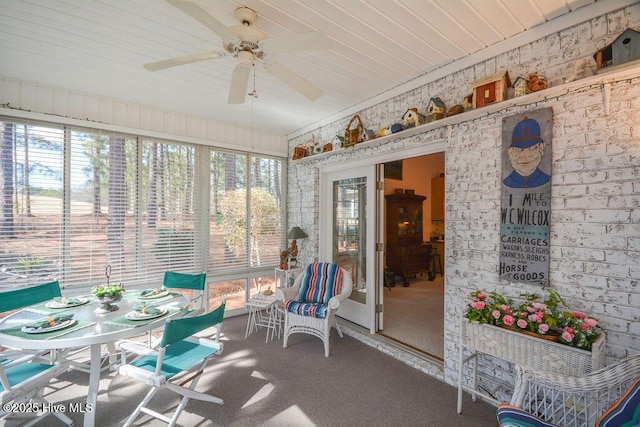 sunroom / solarium with ceiling fan