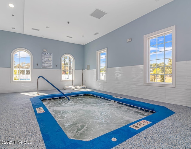 interior space featuring an indoor in ground hot tub