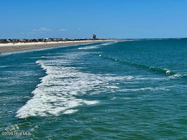 property view of water featuring a beach view