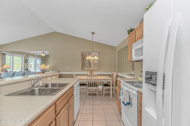 kitchen featuring light tile patterned floors, white appliances, a sink, vaulted ceiling, and light countertops