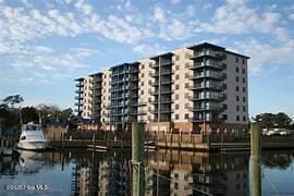 property view of water featuring a dock