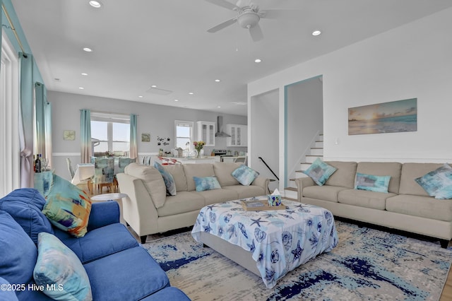 living room with stairway, recessed lighting, and ceiling fan