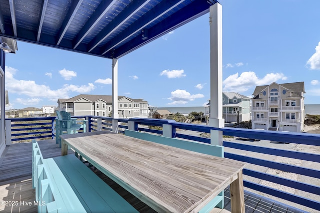 wooden terrace featuring a residential view