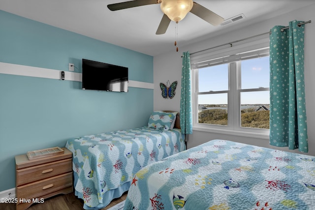 bedroom featuring visible vents and ceiling fan