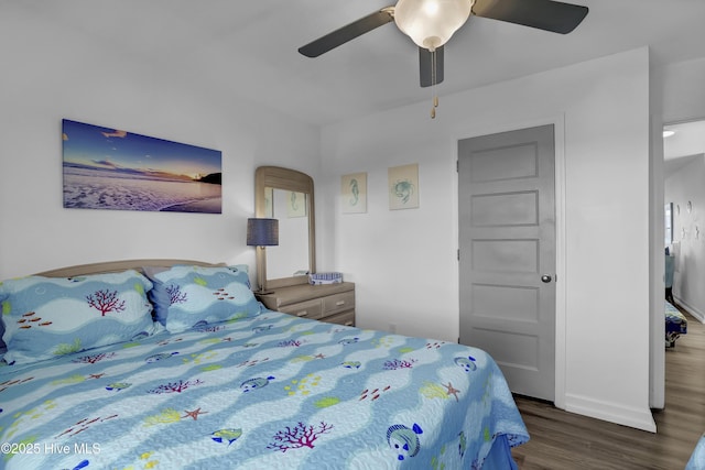 bedroom featuring wood finished floors and ceiling fan