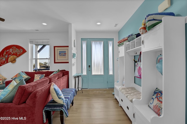 mudroom with light wood-style flooring, recessed lighting, and visible vents