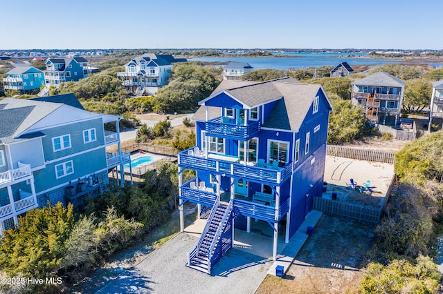 birds eye view of property with a residential view