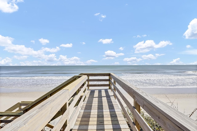 view of property's community featuring a view of the beach and a water view