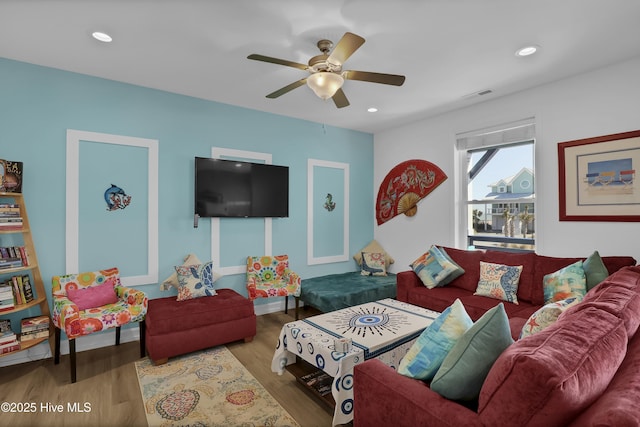 living area with visible vents, recessed lighting, a ceiling fan, and wood finished floors