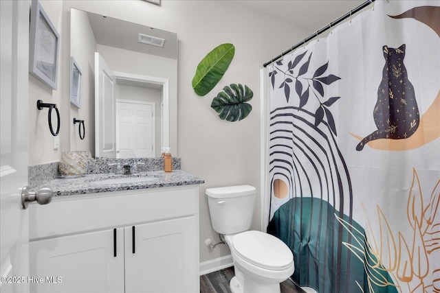 full bath featuring curtained shower, toilet, wood finished floors, vanity, and visible vents