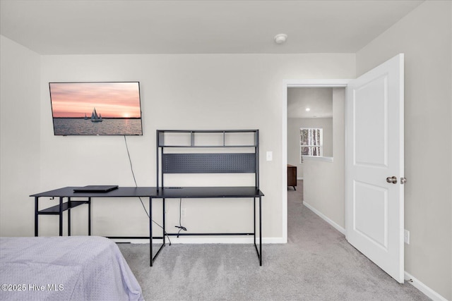 carpeted bedroom featuring baseboards