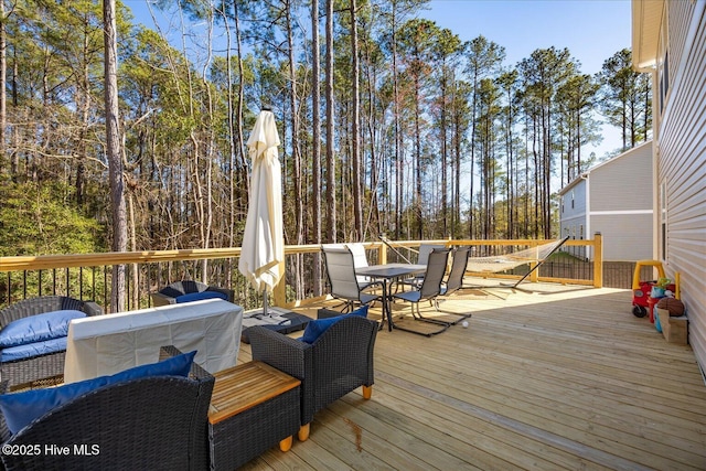 deck with outdoor dining space