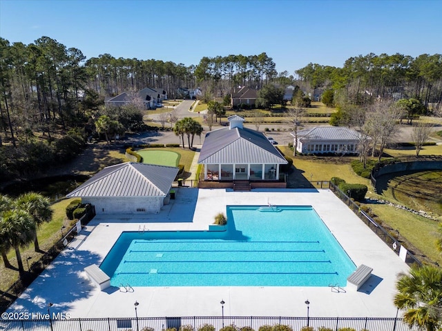 pool with a gazebo, fence, and a patio