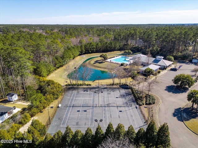 bird's eye view featuring a wooded view