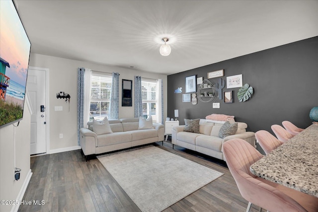 living area featuring wood finished floors and baseboards