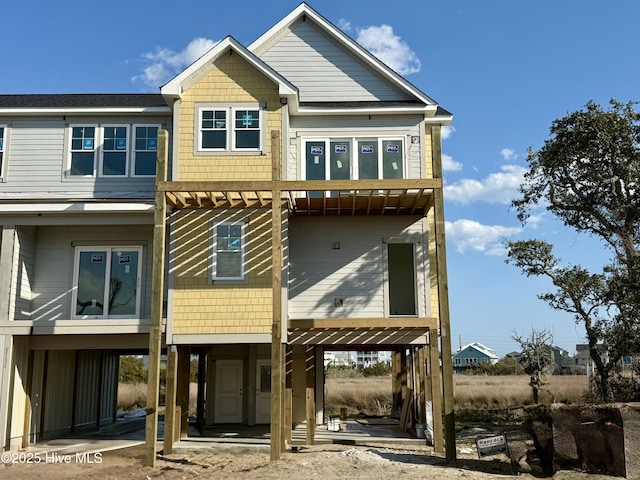 back of property featuring a carport