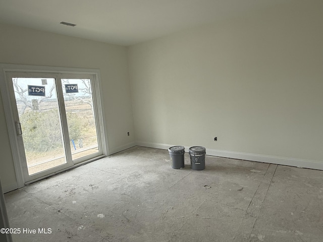 empty room featuring baseboards