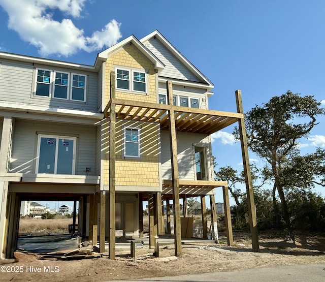 view of front of property featuring a carport