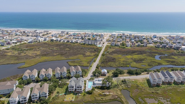 birds eye view of property with a water view and a residential view