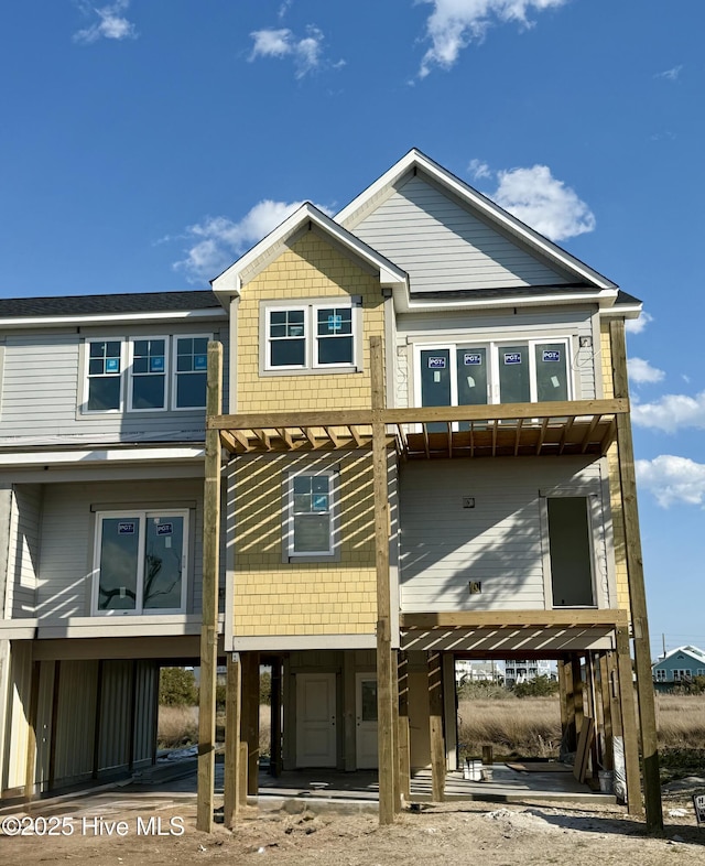 rear view of house featuring a carport