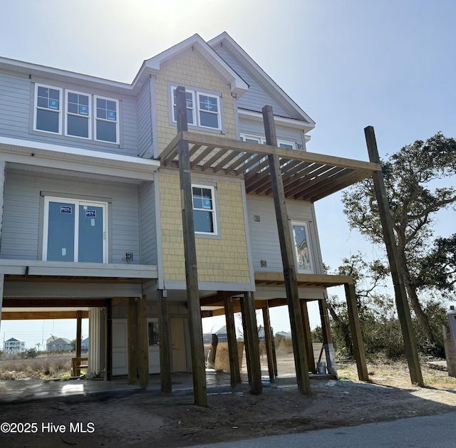 beach home featuring a carport