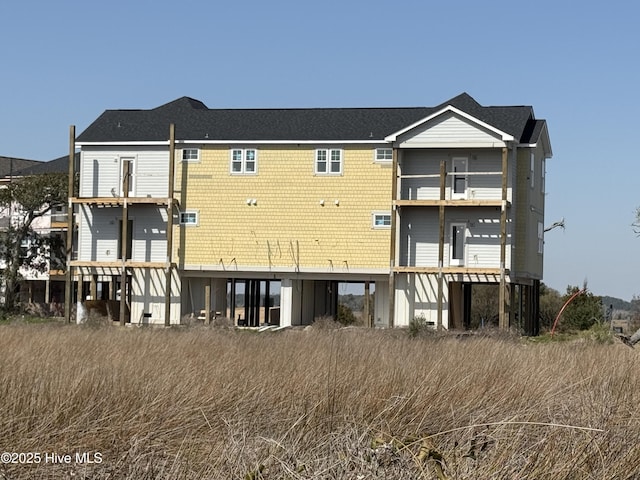 rear view of property with a balcony