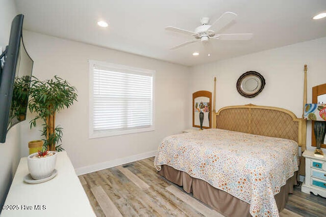 226 NE 76th St, Oak Island, NC 28465 - bedroom featuring wood finished floors, recessed lighting, ceiling fan, and baseboards