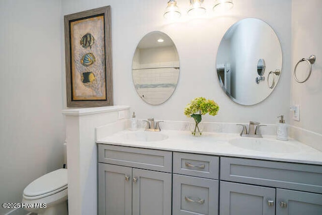 226 NE 76th St, Oak Island, NC 28465 - full bathroom with double vanity and toilet