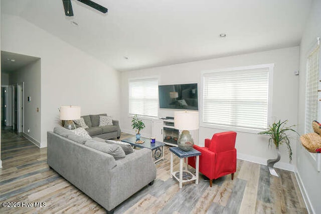 226 NE 76th St, Oak Island, NC 28465 - living room featuring wood finished floors, baseboards, and a ceiling fan