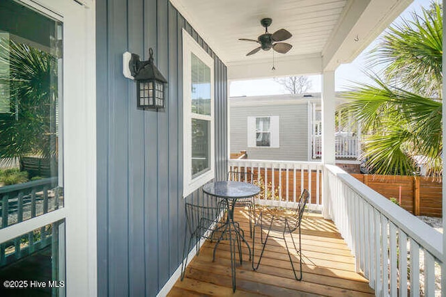 226 NE 76th St, Oak Island, NC 28465 - wooden porch with ceiling fan