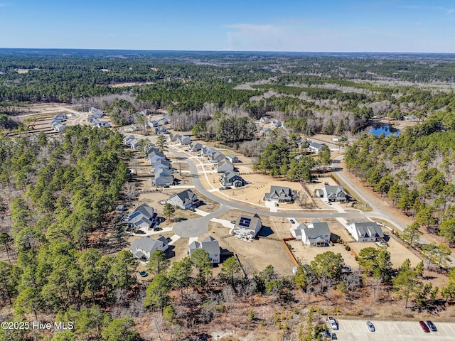 bird's eye view featuring a view of trees