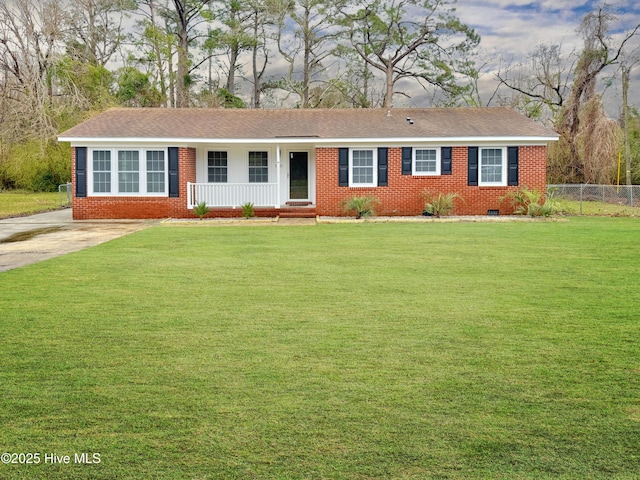 ranch-style house with a front lawn, a porch, fence, and brick siding