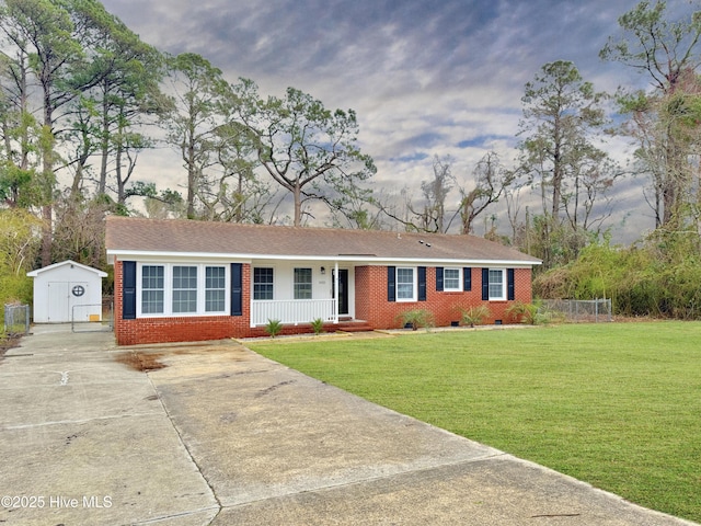 ranch-style house featuring a front lawn, fence, covered porch, crawl space, and brick siding