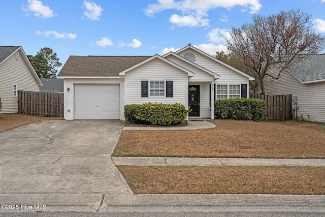 view of front of house with an attached garage, a shingled roof, fence, and concrete driveway