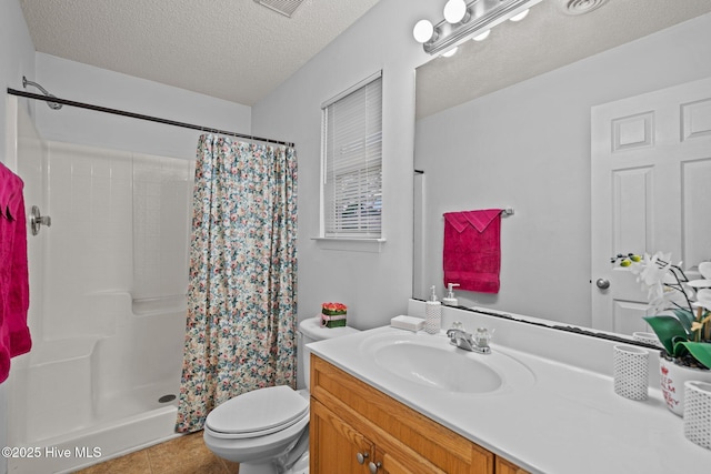 bathroom featuring a textured ceiling, vanity, toilet, and a shower with curtain