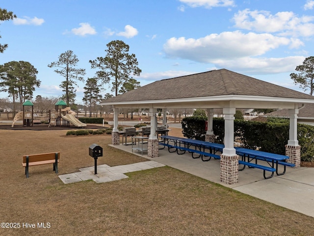 view of community with a yard, playground community, and a gazebo