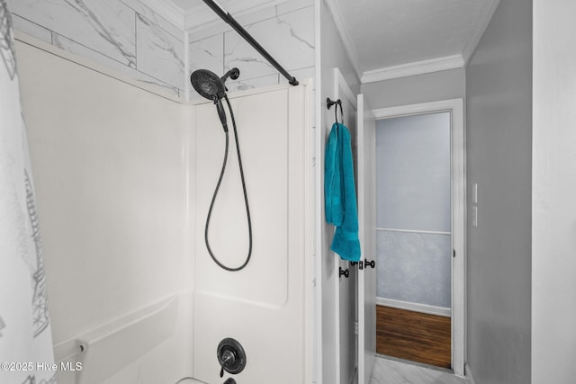 bathroom featuring ornamental molding and shower / washtub combination