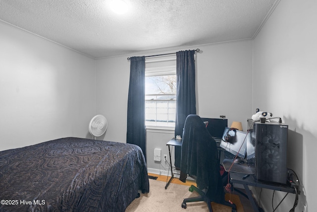 bedroom with crown molding and a textured ceiling