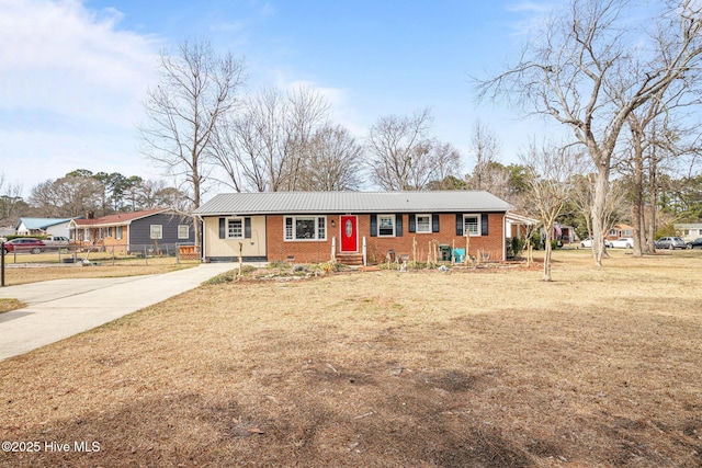 single story home with crawl space, brick siding, metal roof, and fence