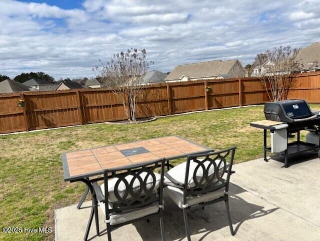 view of patio / terrace featuring outdoor dining area, a fenced backyard, and area for grilling