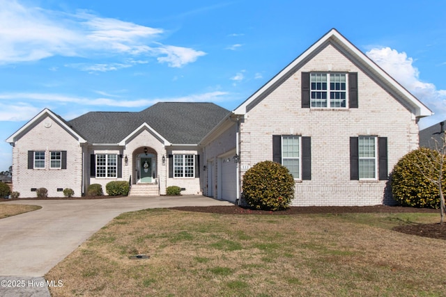 traditional home with brick siding, a front lawn, a garage, crawl space, and driveway