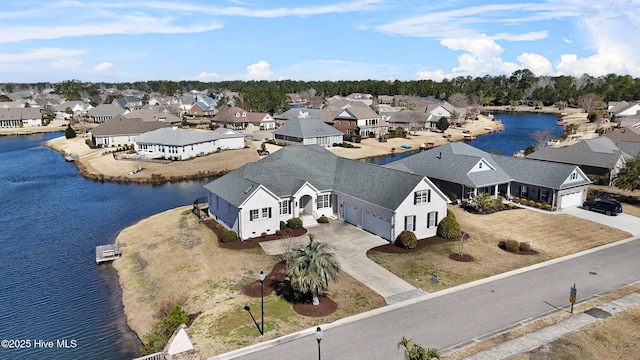 aerial view with a residential view and a water view